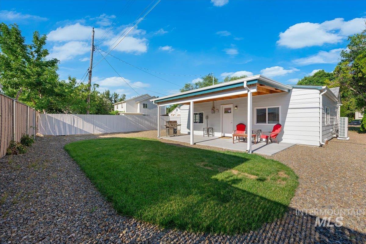 Back of property with a patio area and a fenced backyard