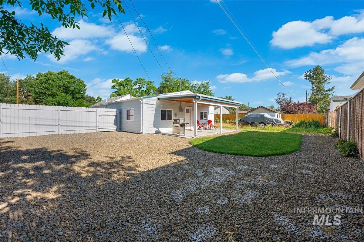 Back of property featuring a patio and a fenced backyard