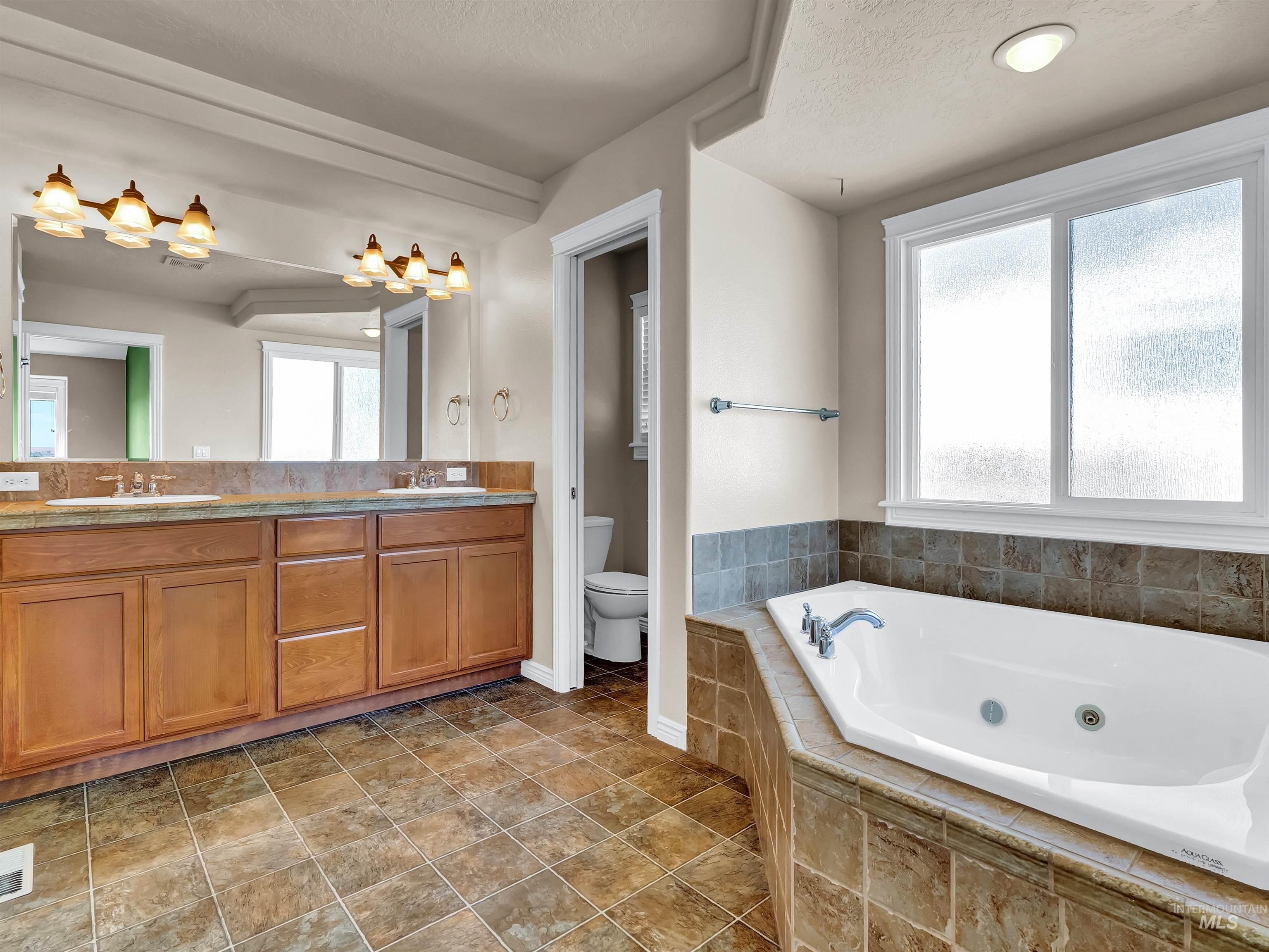 9303 W Stirrup Drive, Boise, Idaho 83709, 4 Bedrooms, 2.5 Bathrooms, Residential For Sale, Price $594,900, 98960066