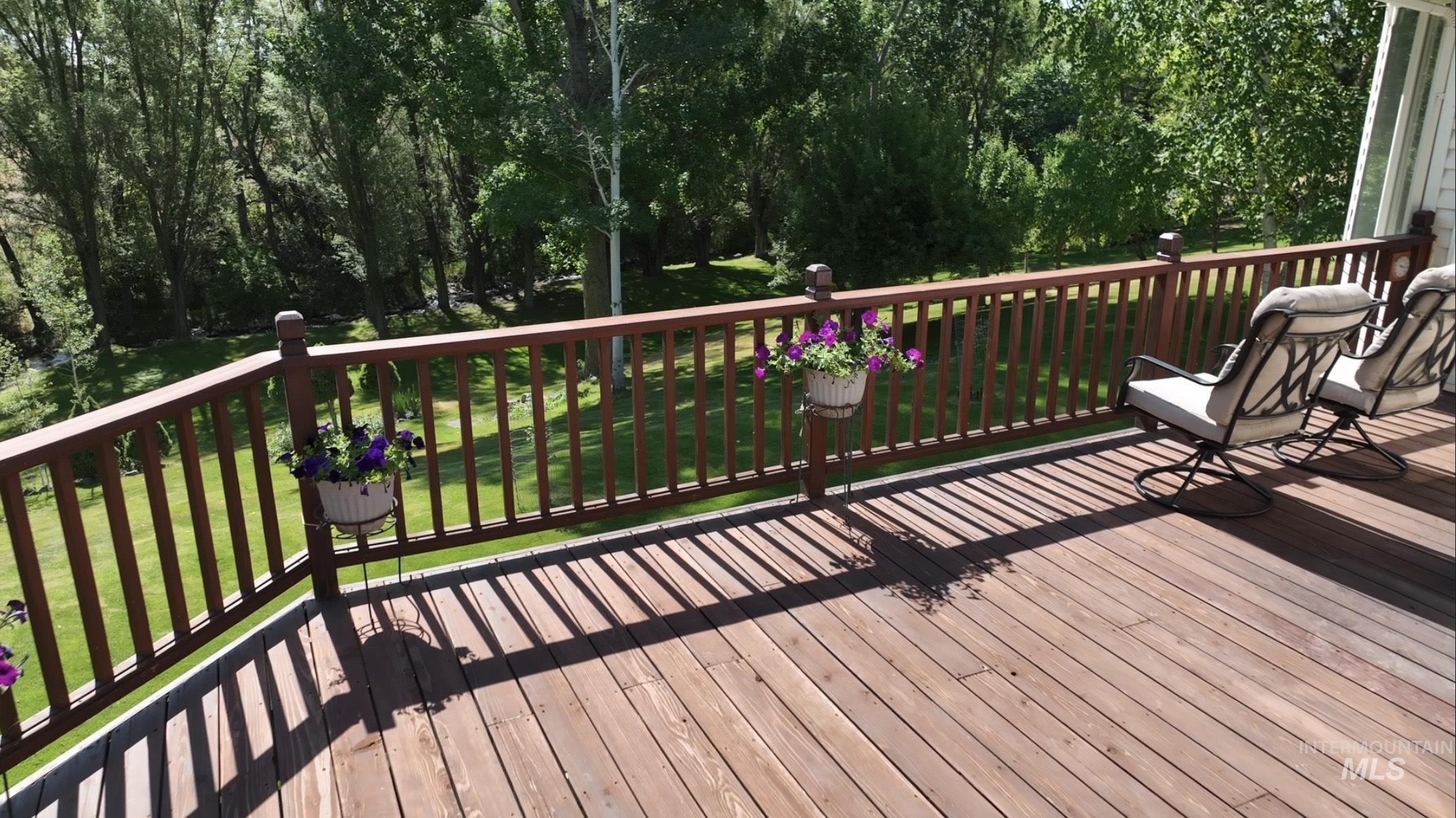 Wooden terrace with a lawn