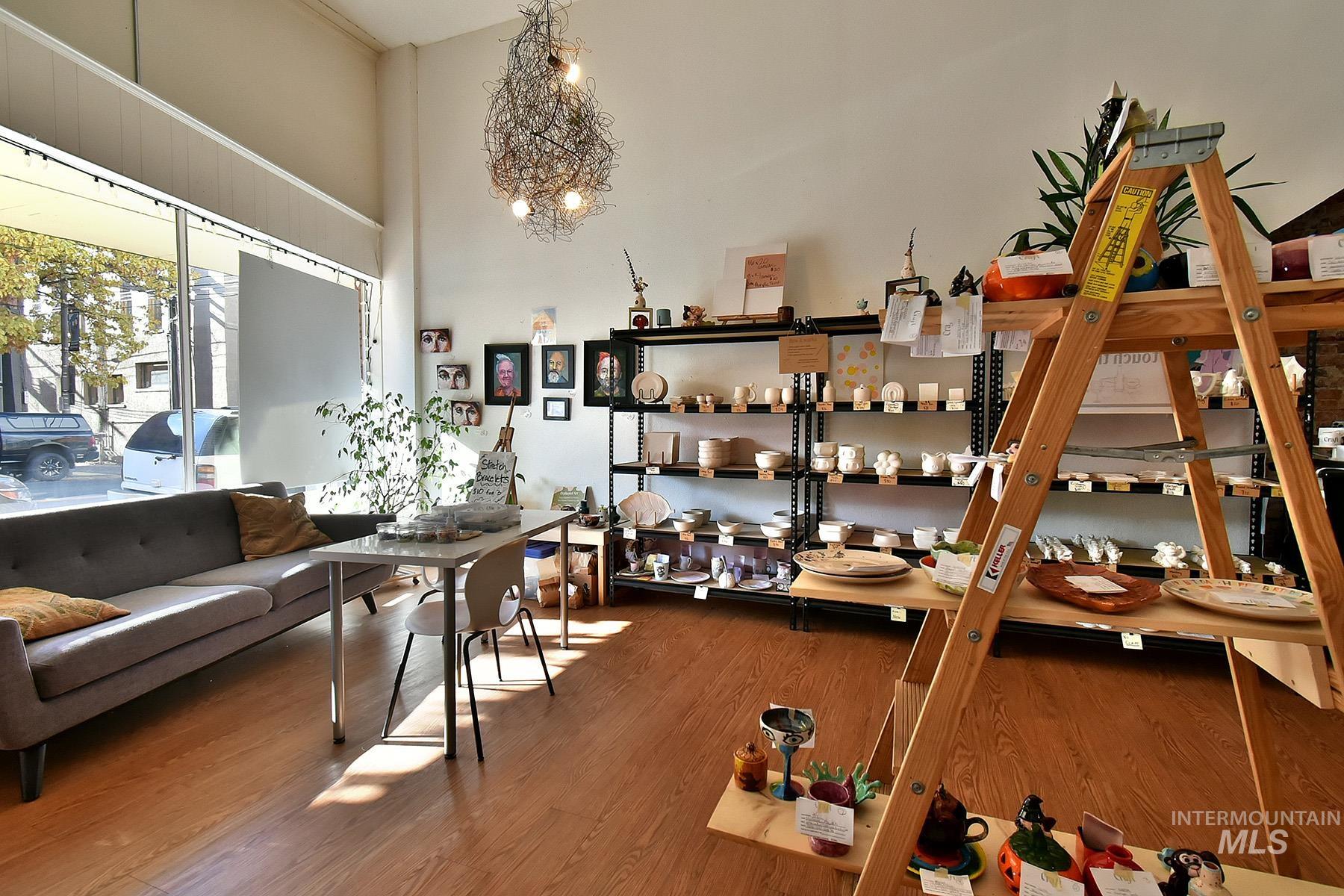 Interior space featuring wood finished floors and a towering ceiling