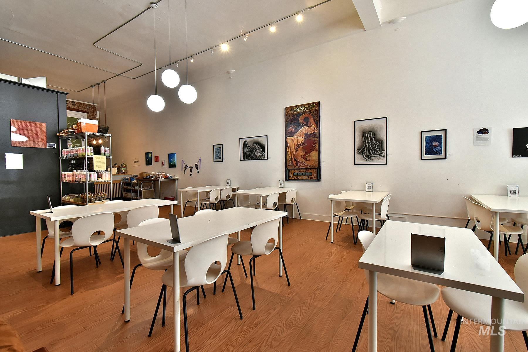 Dining space with light wood-style floors
