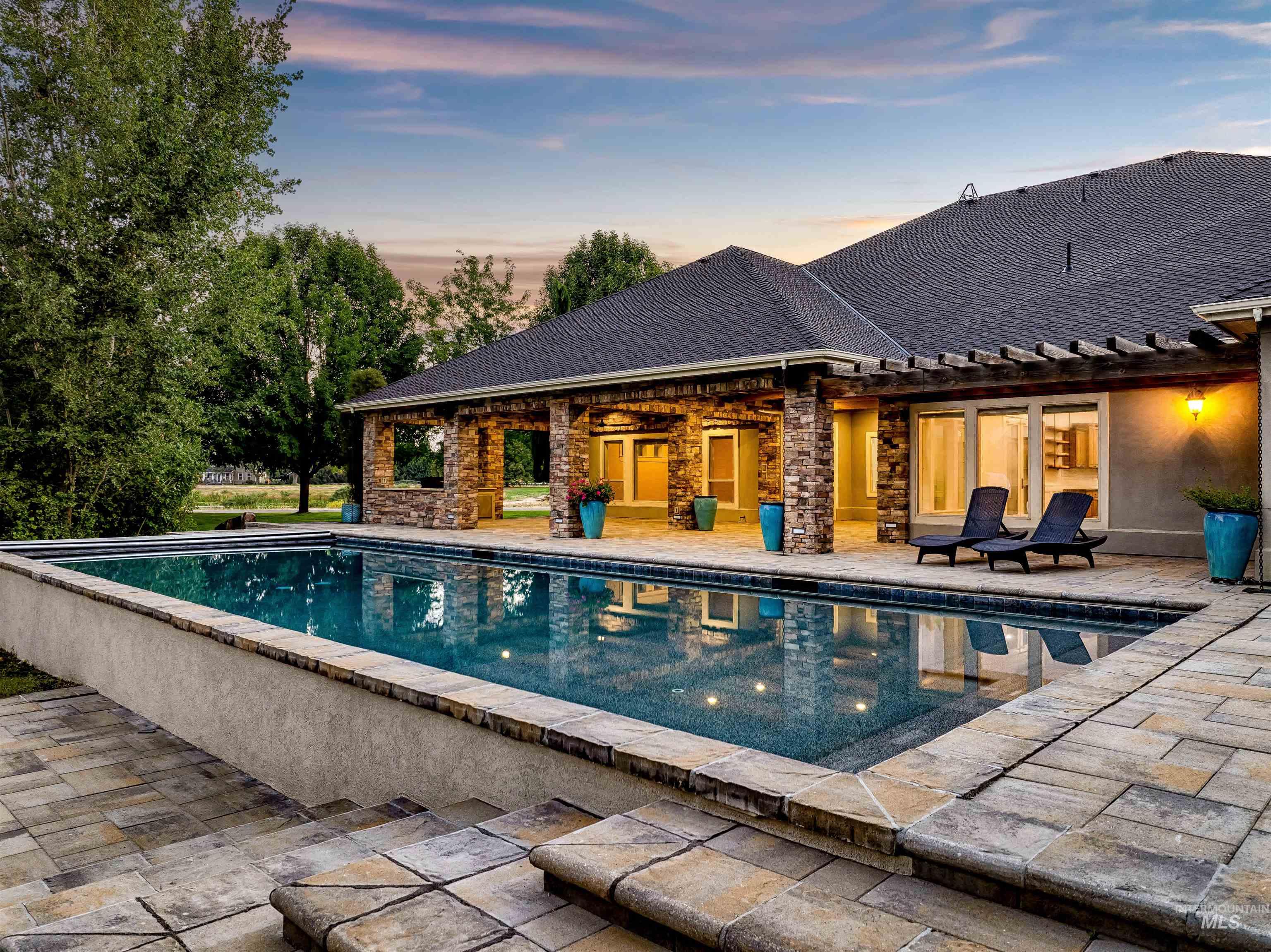 Swimming pool featuring a patio and a pergola