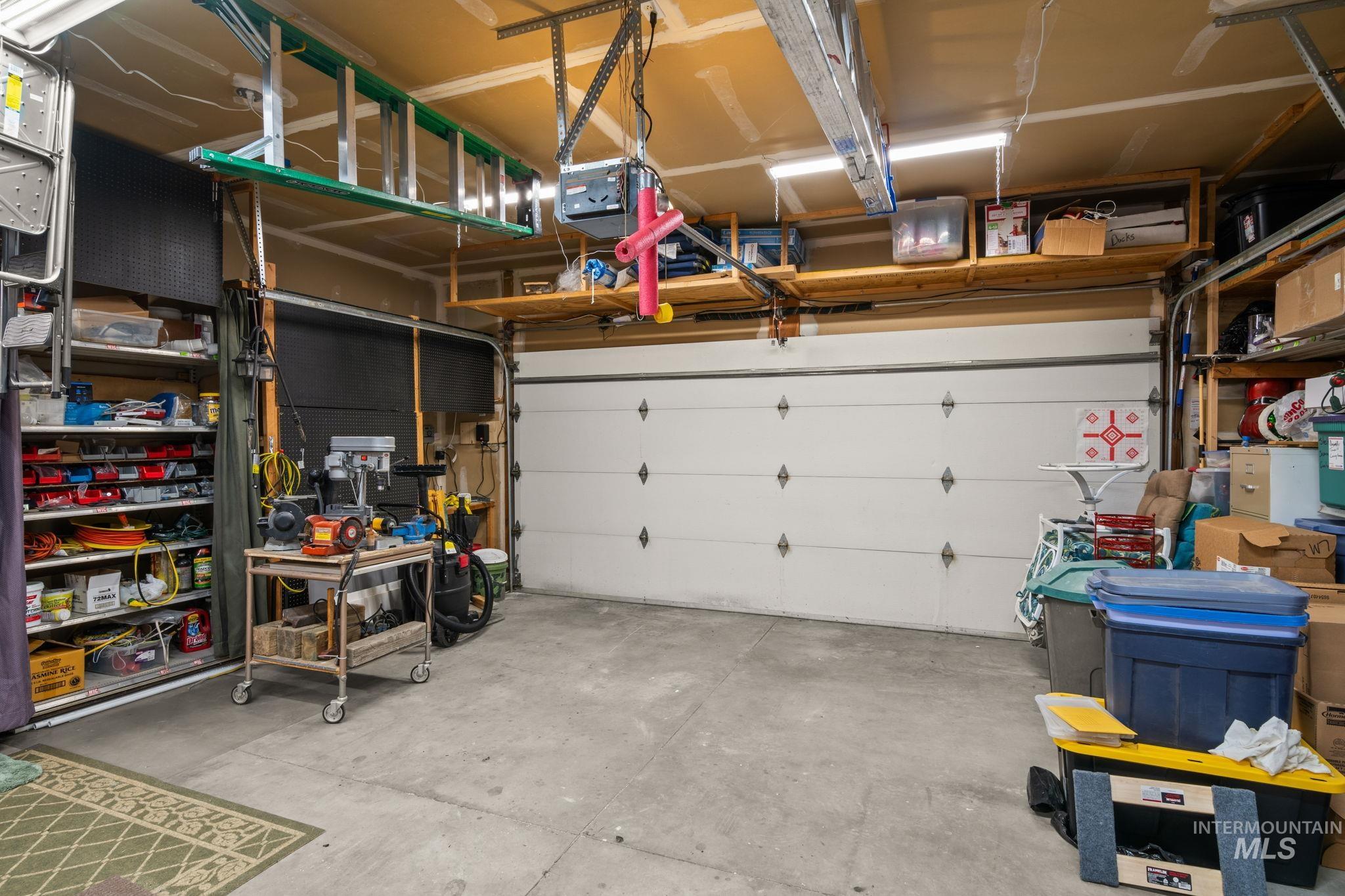 Garage featuring a garage door opener