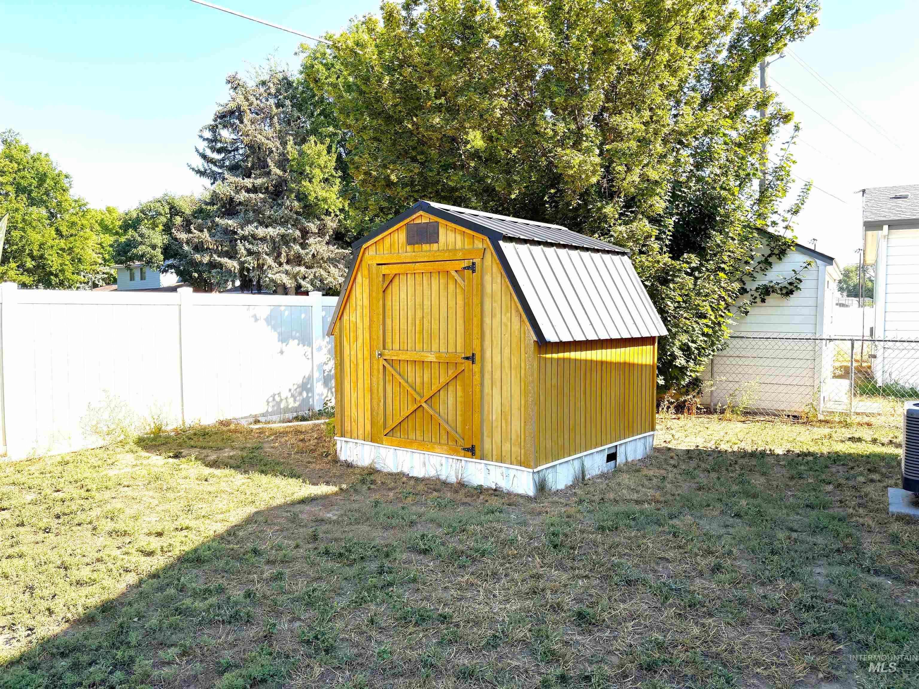 View of shed with a fenced backyard