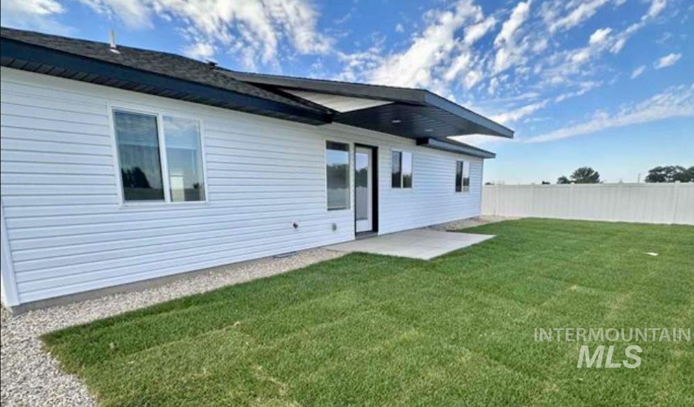 Rear view of house with a patio