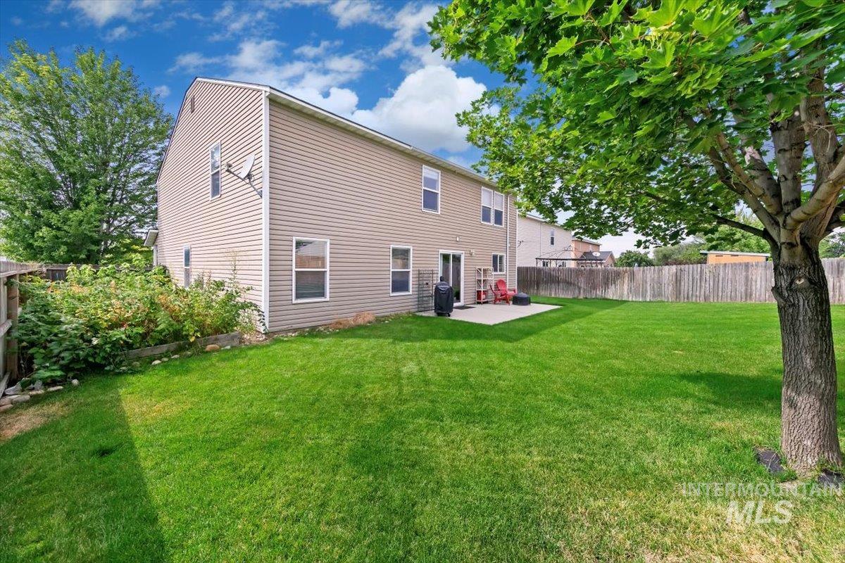 Rear view of property with a patio area