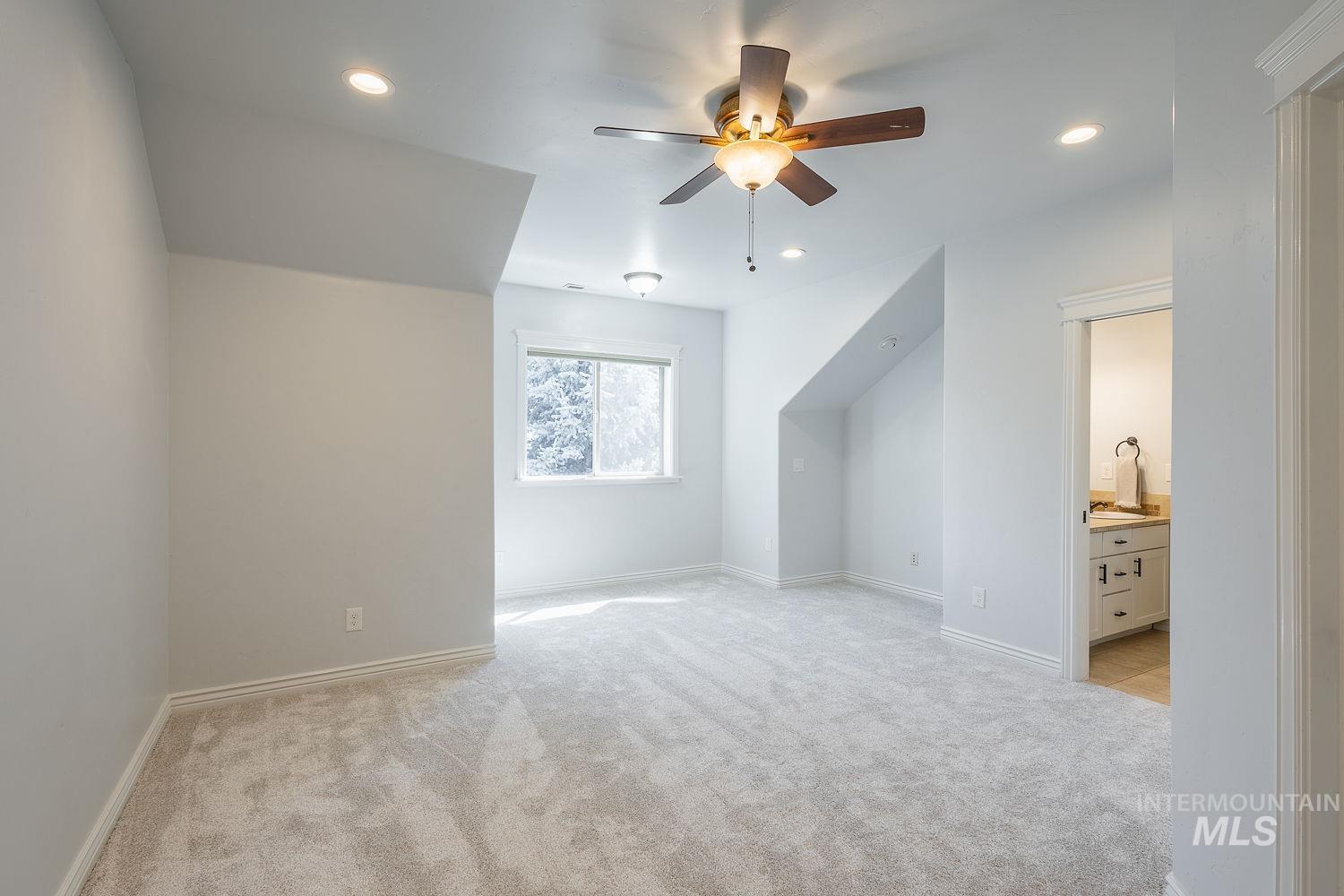 Bonus room with light colored carpet, recessed lighting, and ceiling fan