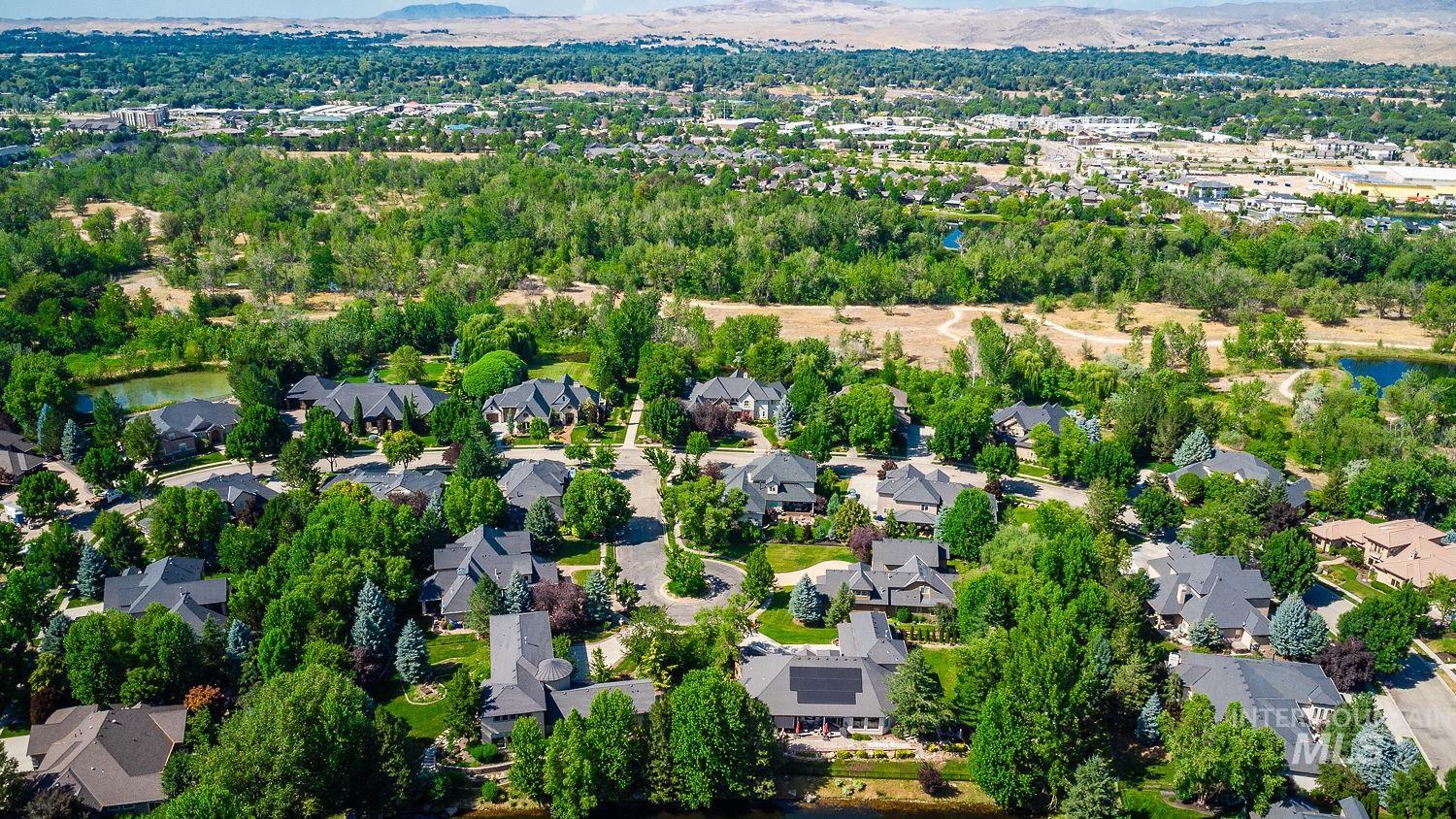 Aerial perspective of suburban area featuring a water and mountain view