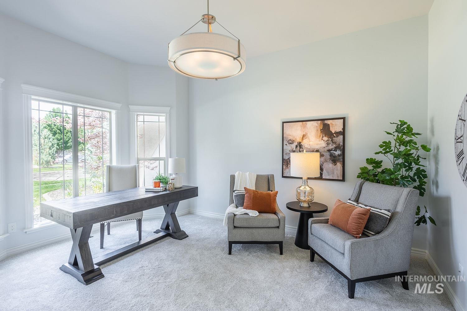 Office with carpet flooring and baseboards
