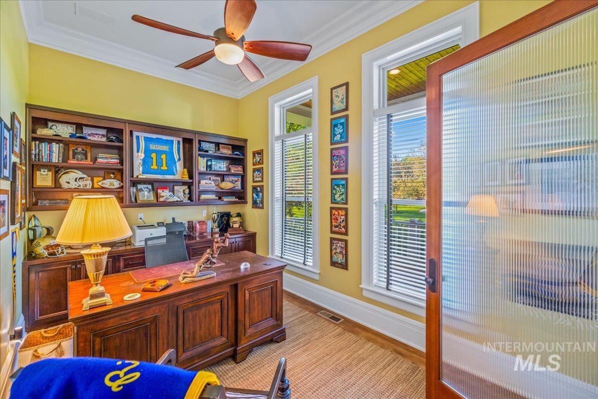 Office featuring ornamental molding and ceiling fan