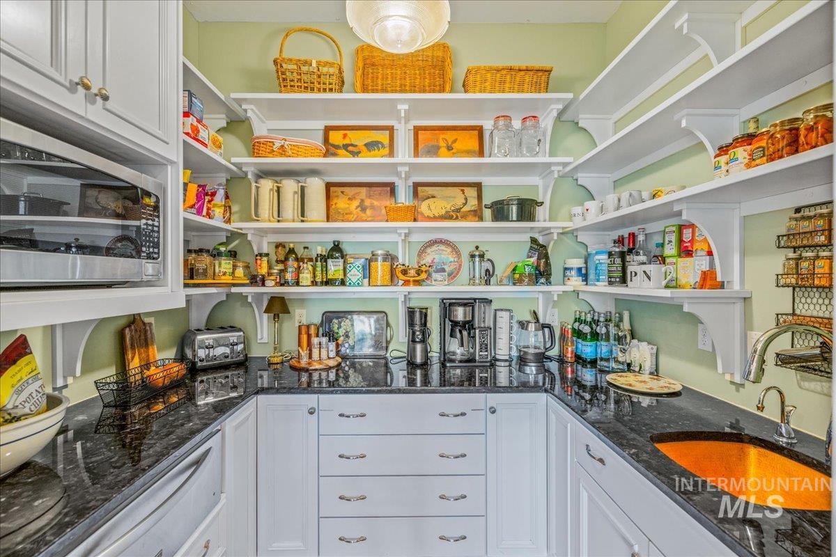 Pantry featuring a sink