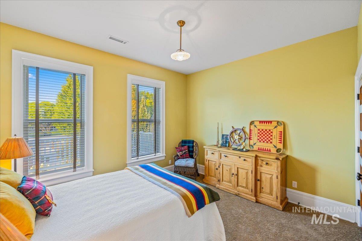 Carpeted bedroom with baseboards