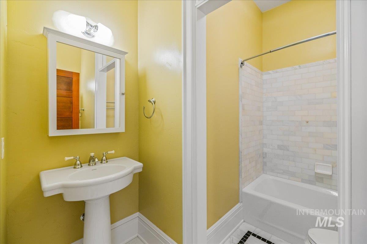 Full bathroom featuring bathing tub / shower combination and tile patterned floors