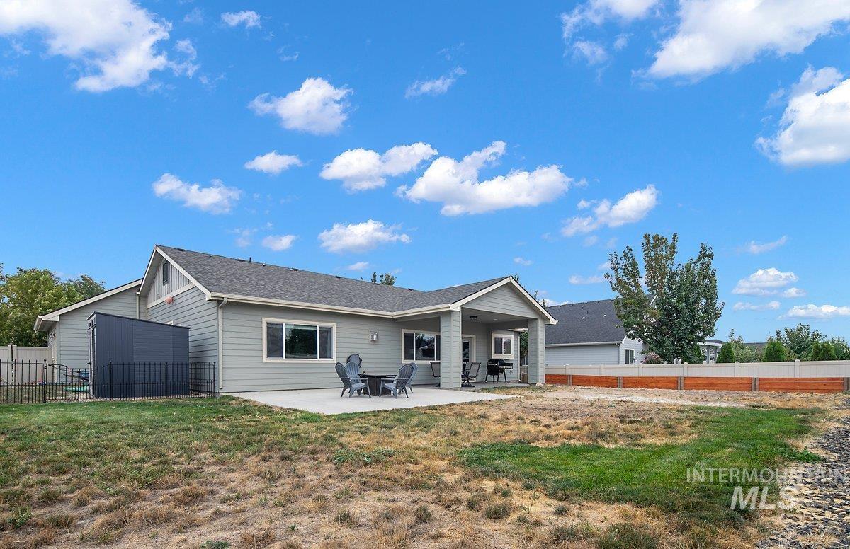 Back of house with a patio and a fenced backyard