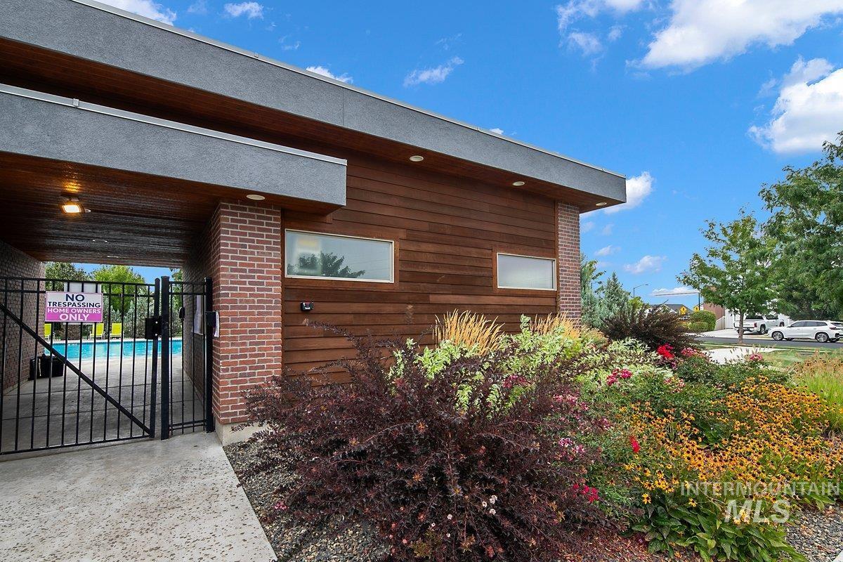 View of home's exterior with a patio area and a gate