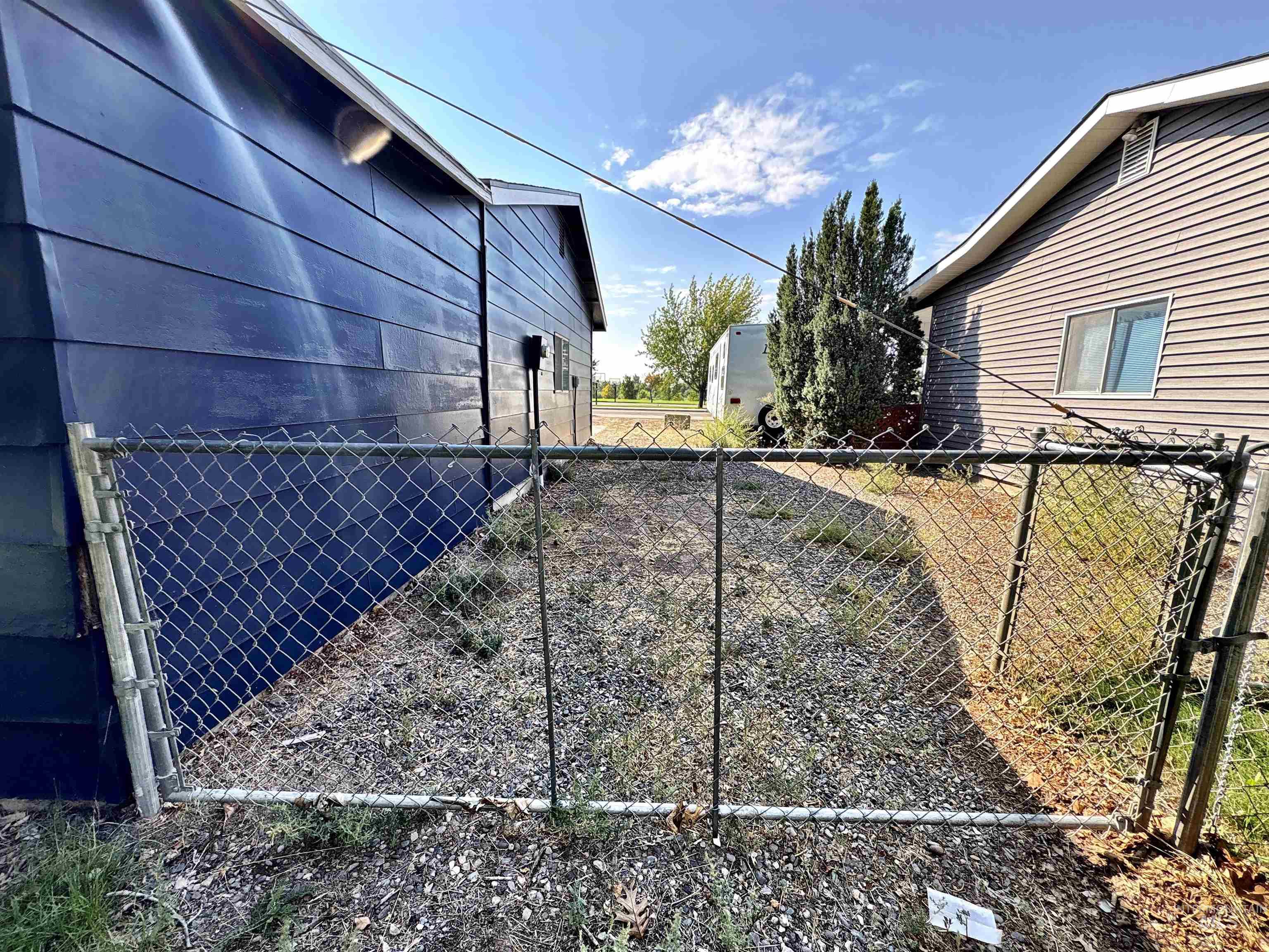 View of side yard with large gate