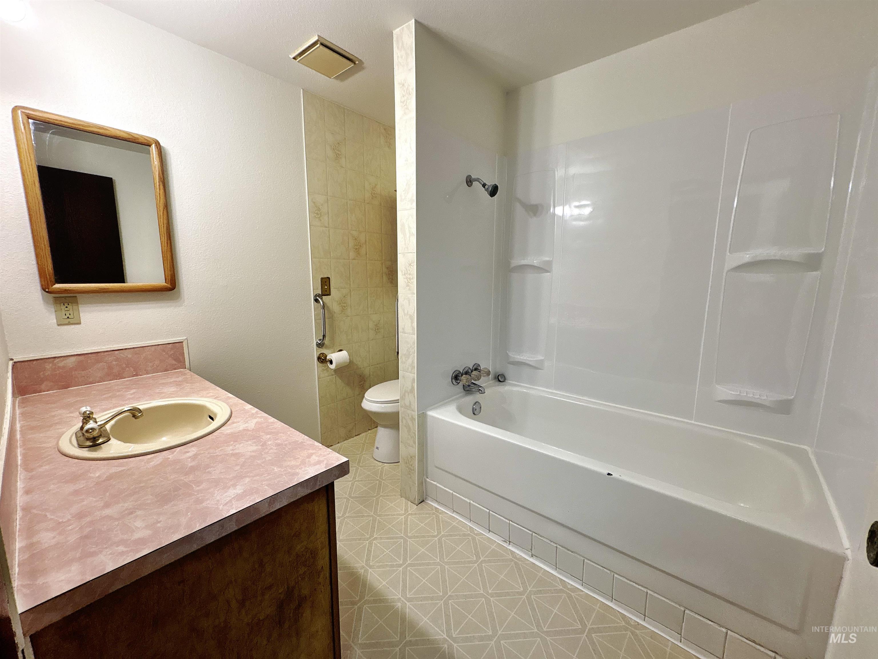 Full bathroom featuring shower / washtub combination and vanity