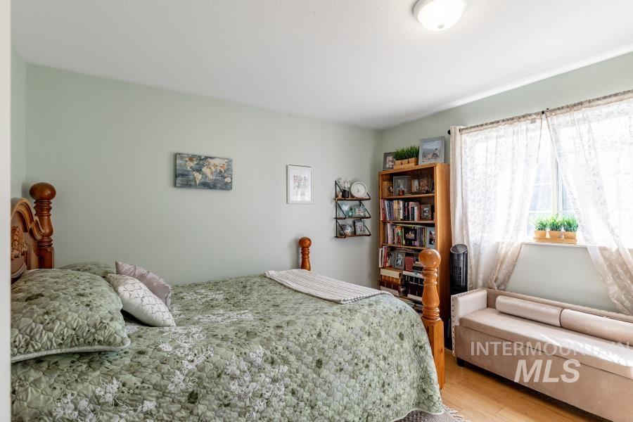 Bedroom with wood finished floors