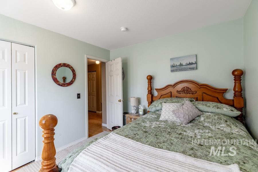 Bedroom with a closet and baseboards
