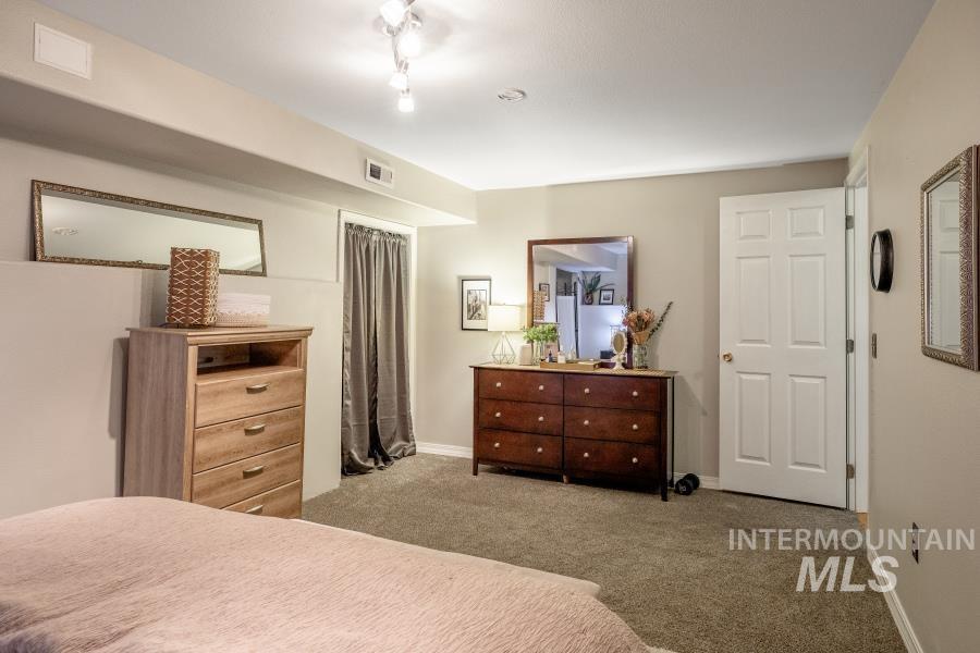 Bedroom with carpet and baseboards