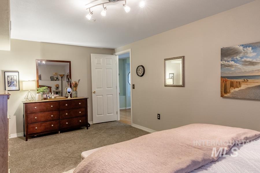 Bedroom with light carpet