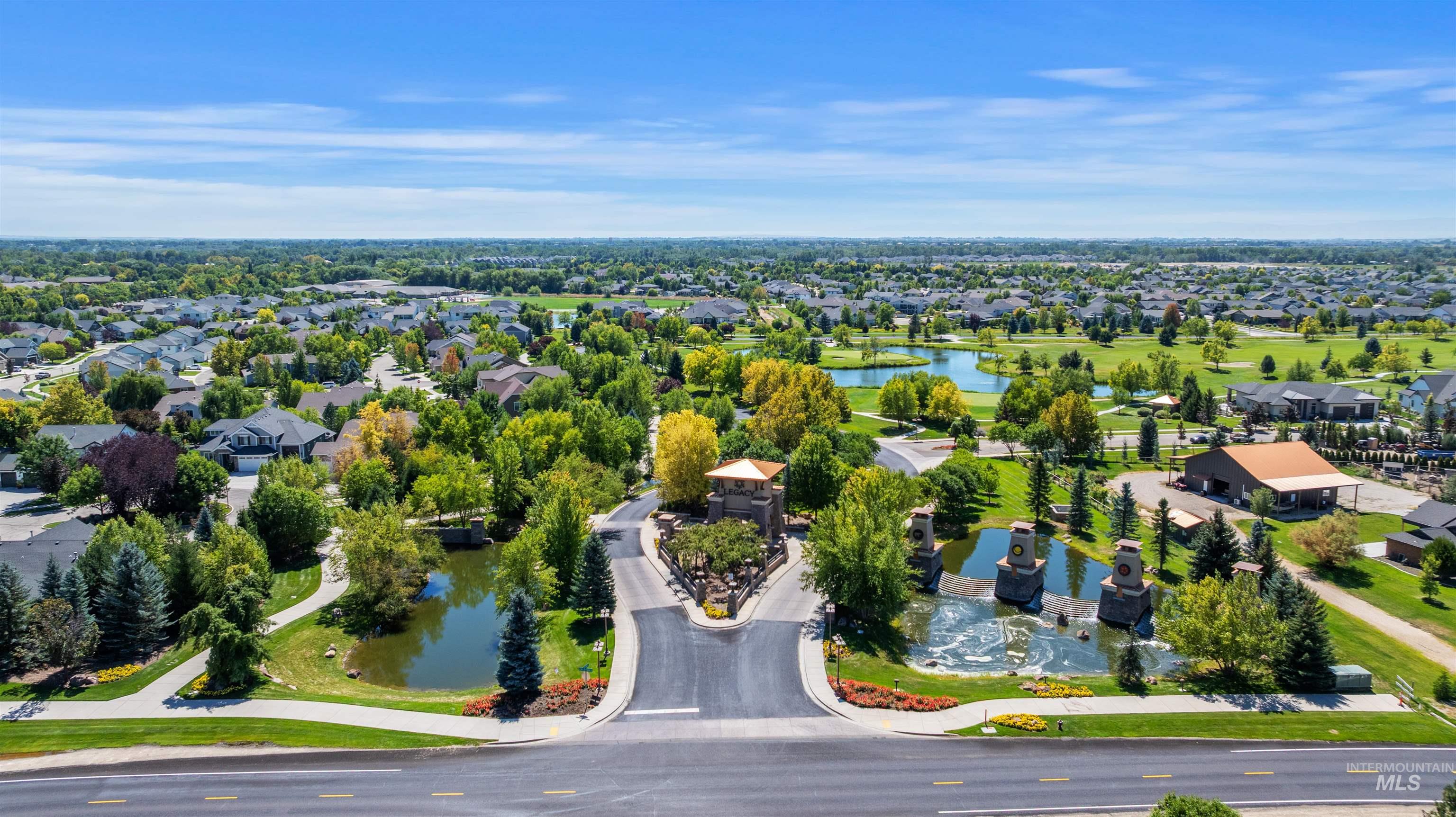 Aerial perspective of suburban area featuring a large body of water