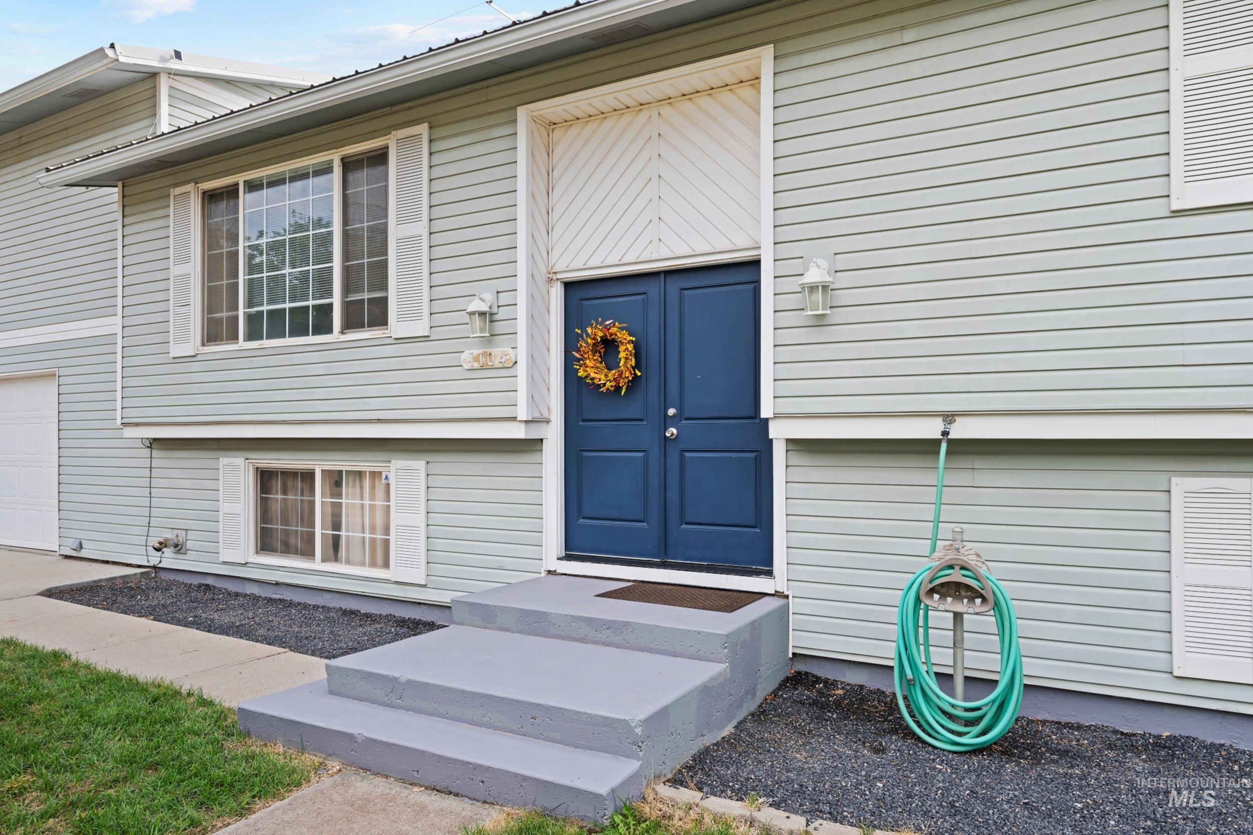 Entrance to property with a garage
