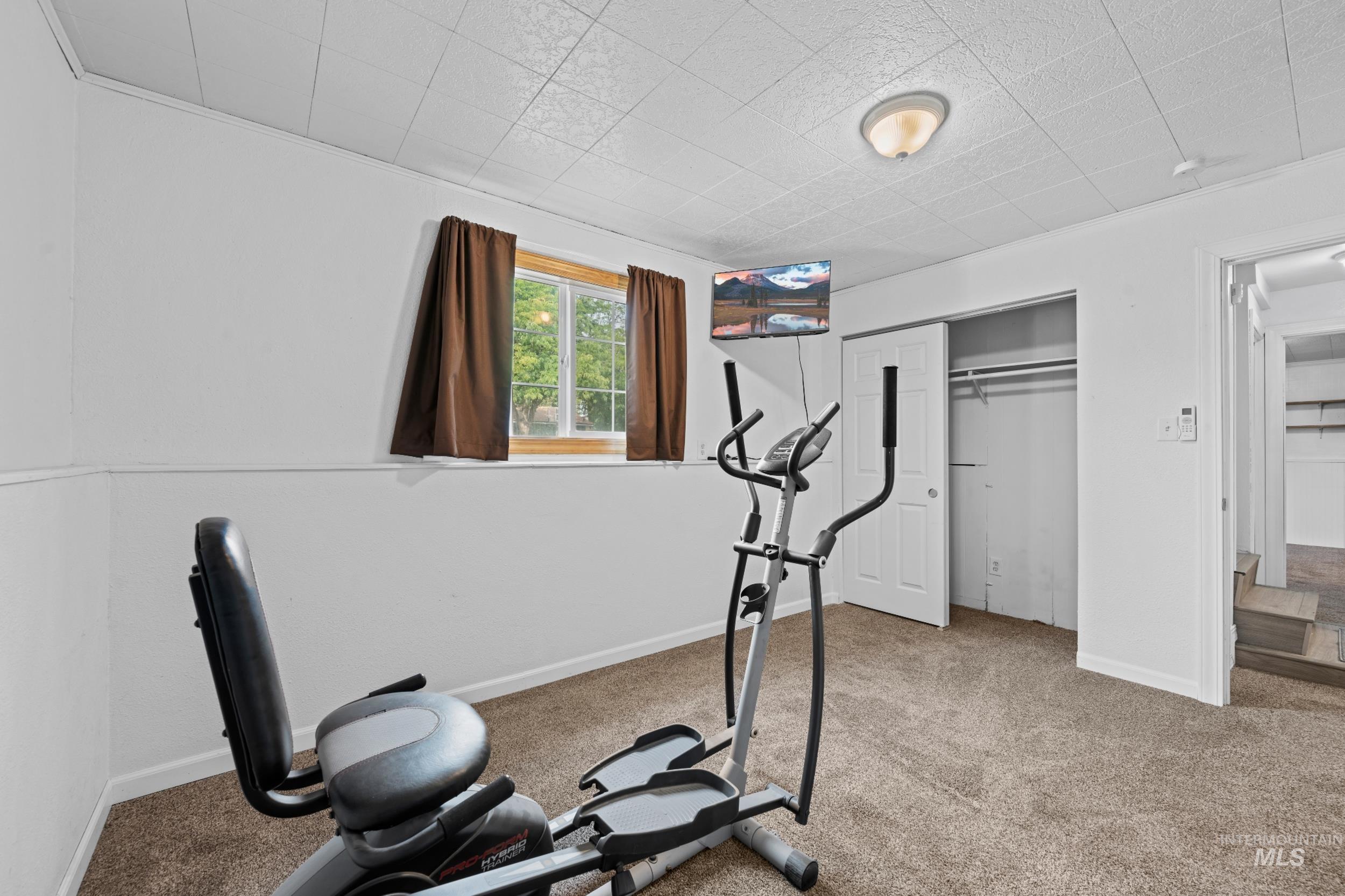 Exercise area featuring carpet floors