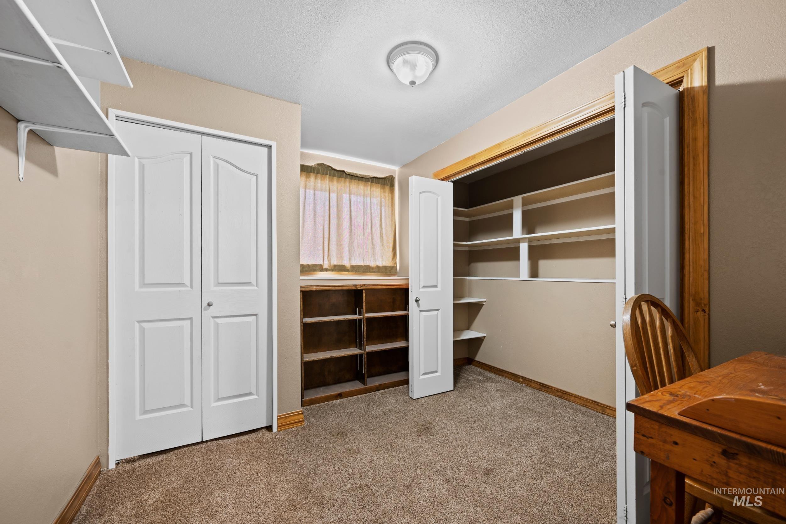 Unfurnished office featuring light colored carpet and baseboards