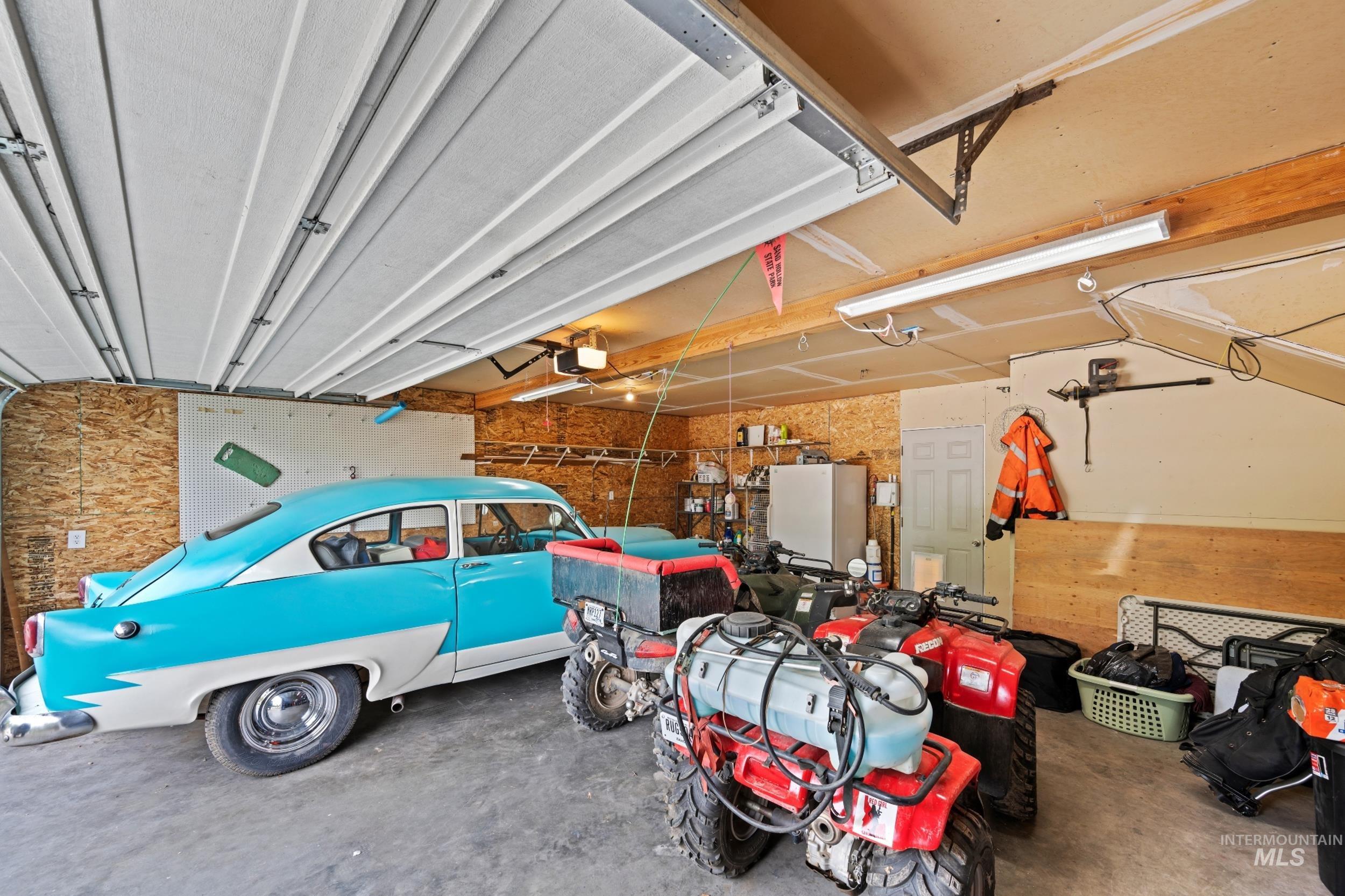 Garage with freestanding refrigerator