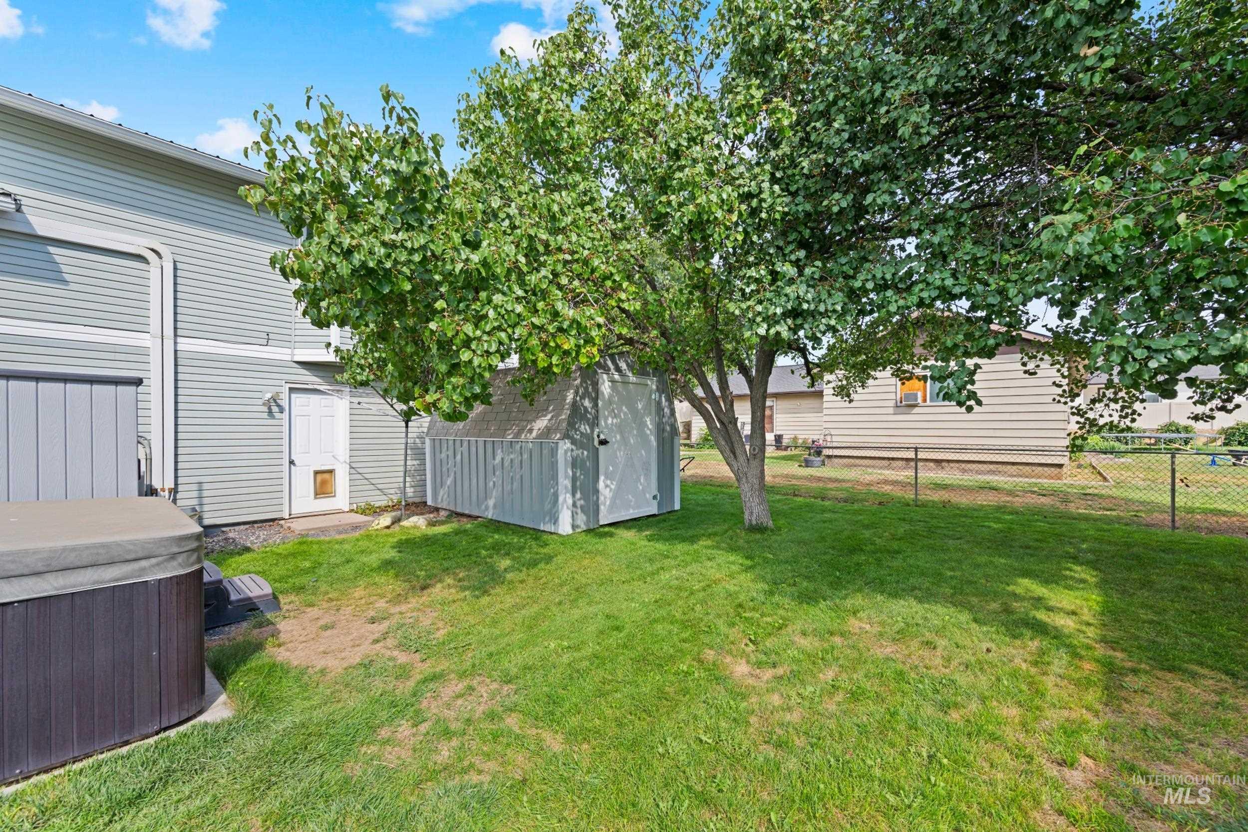 View of yard with a hot tub