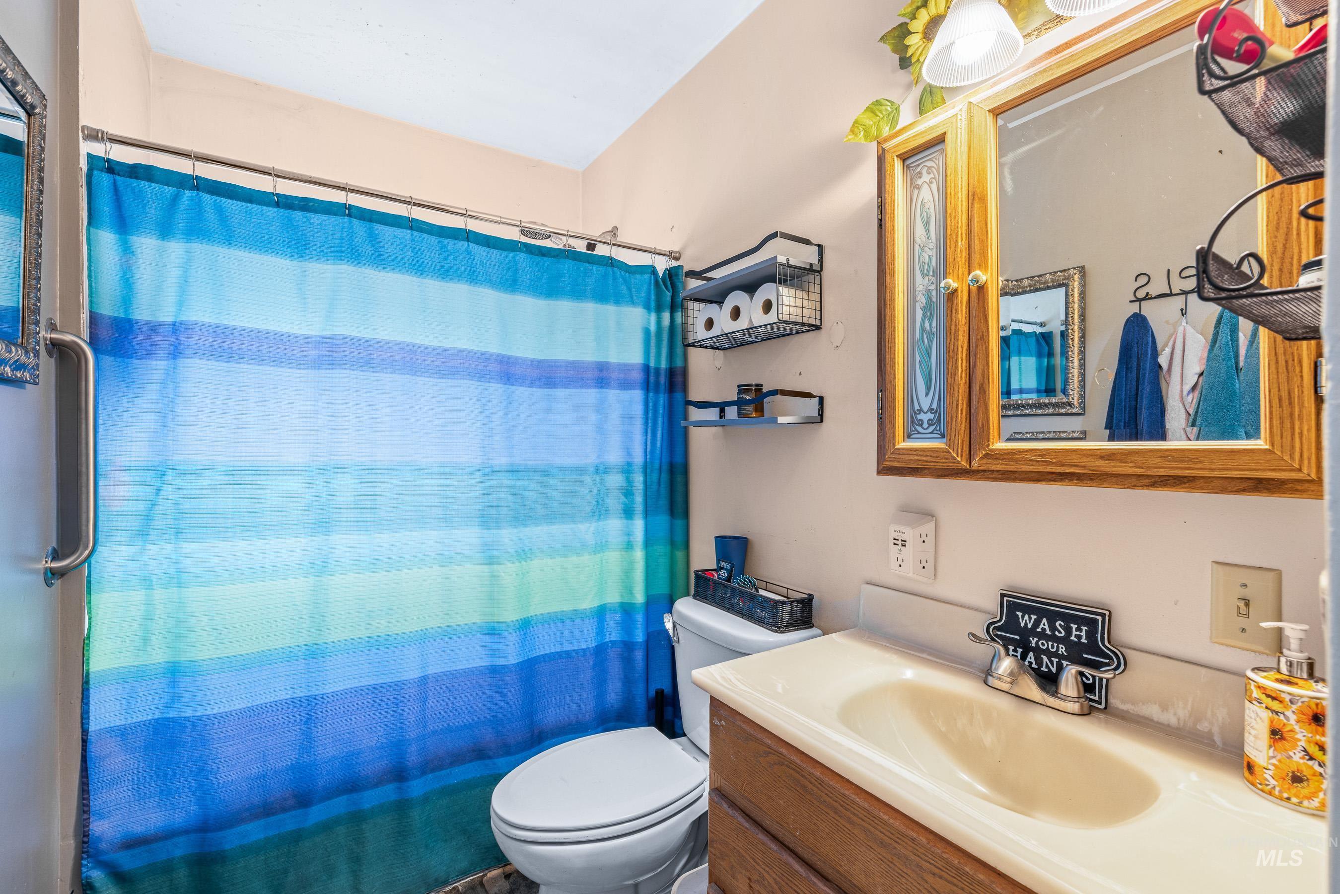 Bathroom featuring toilet and vanity