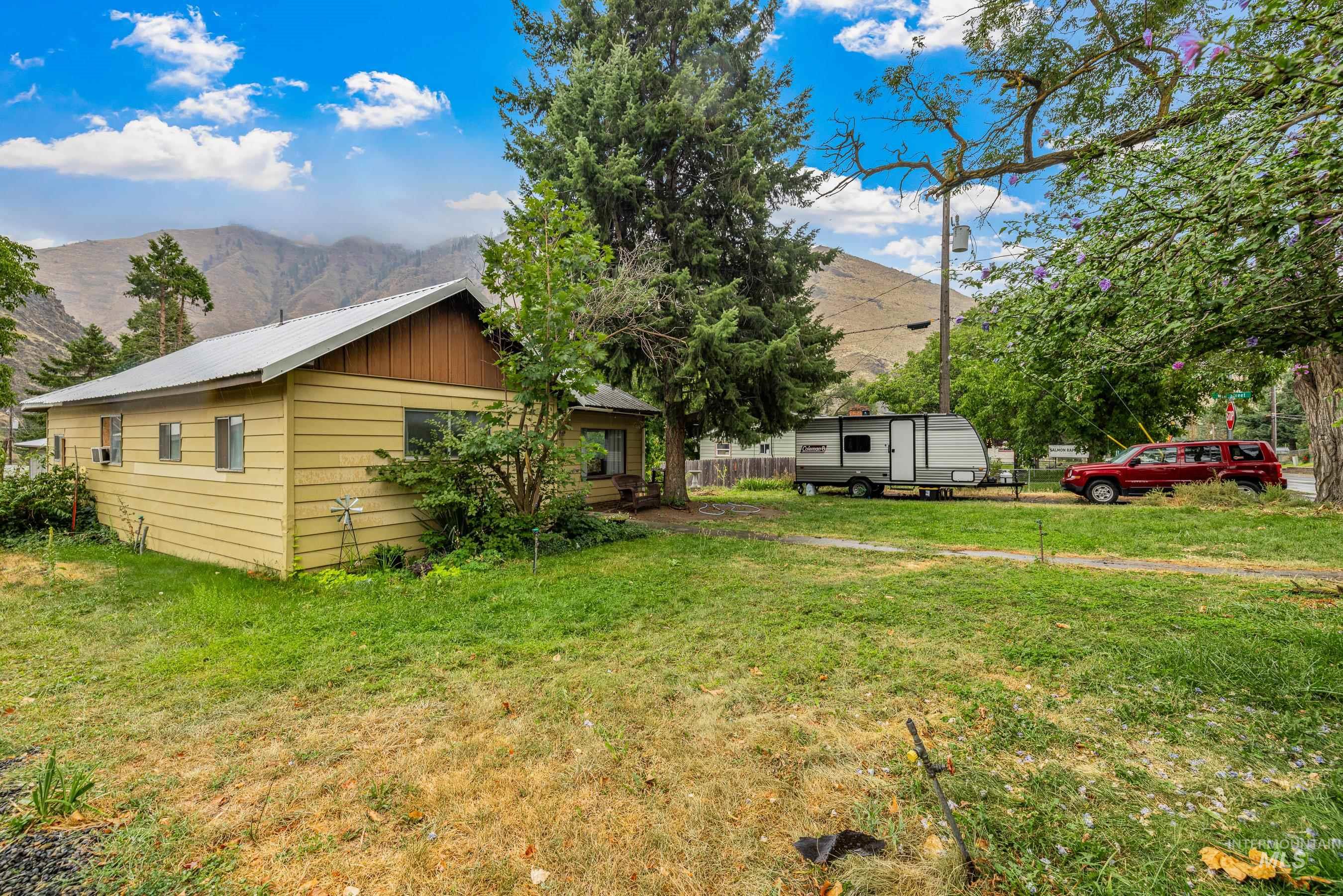 View of yard with a mountain view and cooling unit