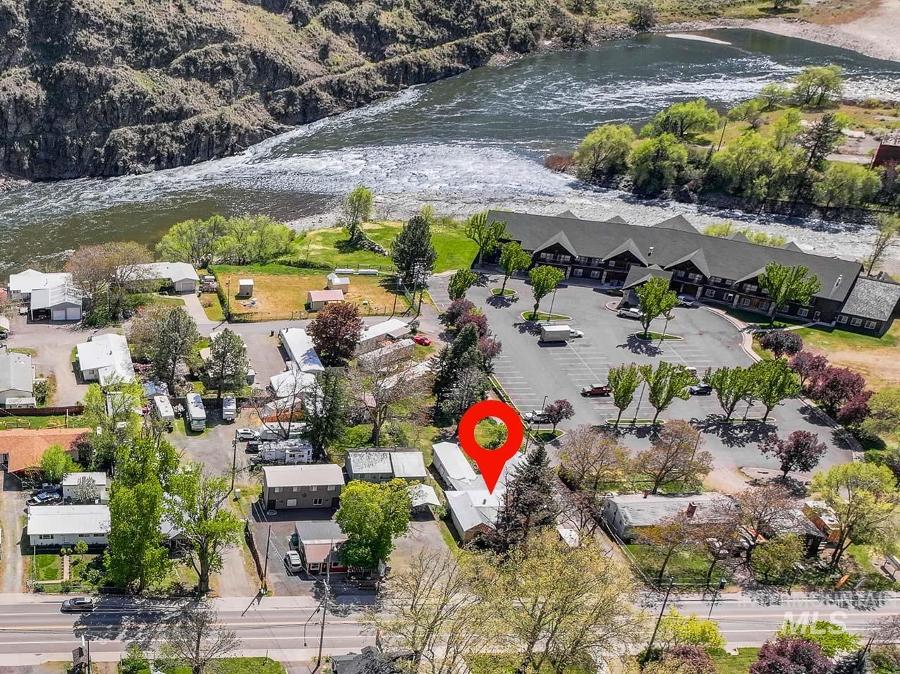 Aerial overview of property's location with a large body of water