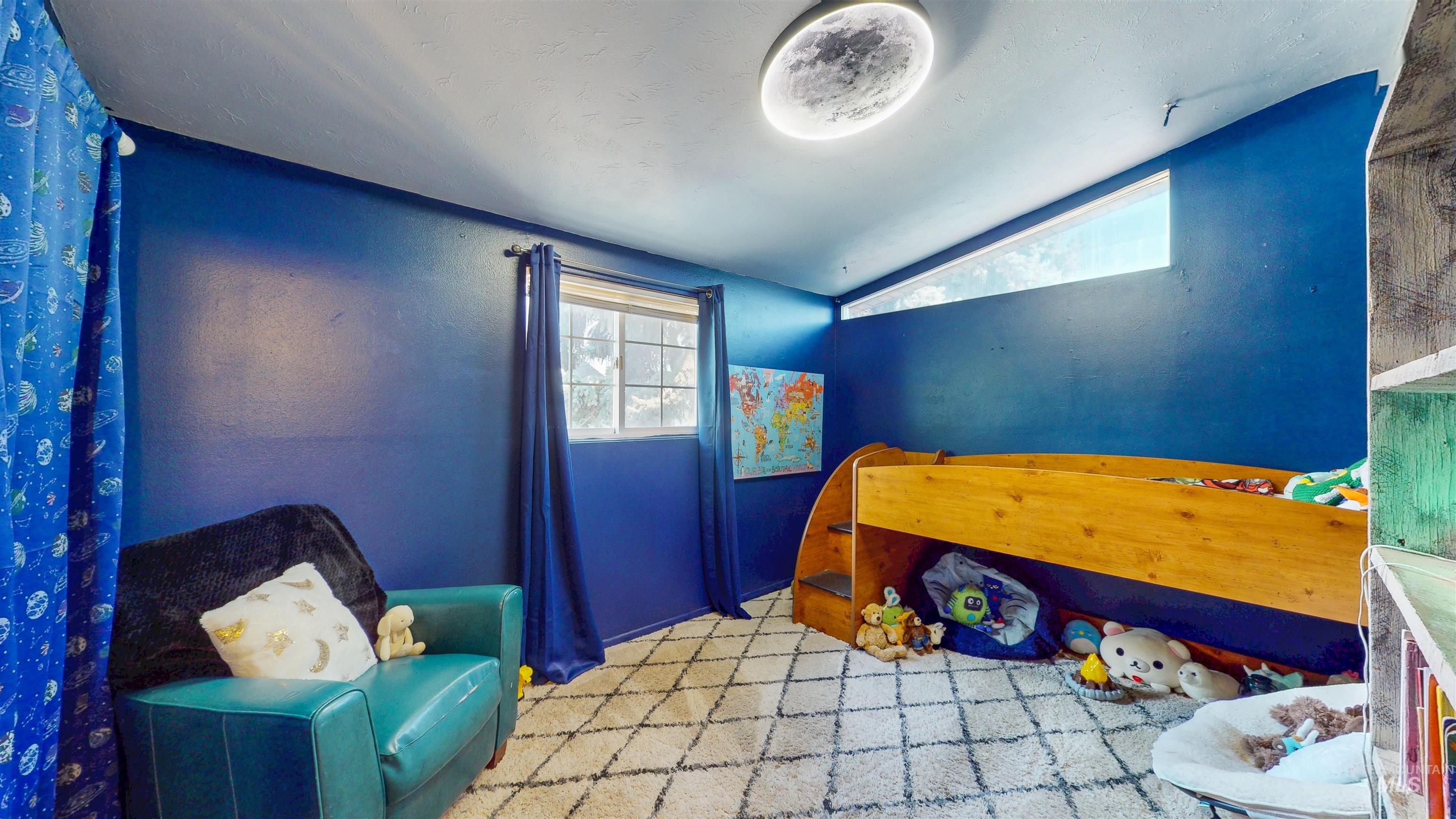 Bedroom featuring lofted ceiling