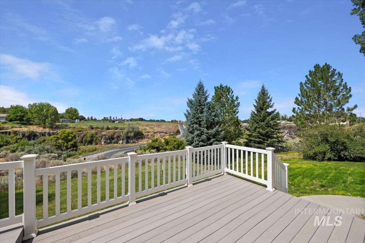 Wooden deck featuring a yard