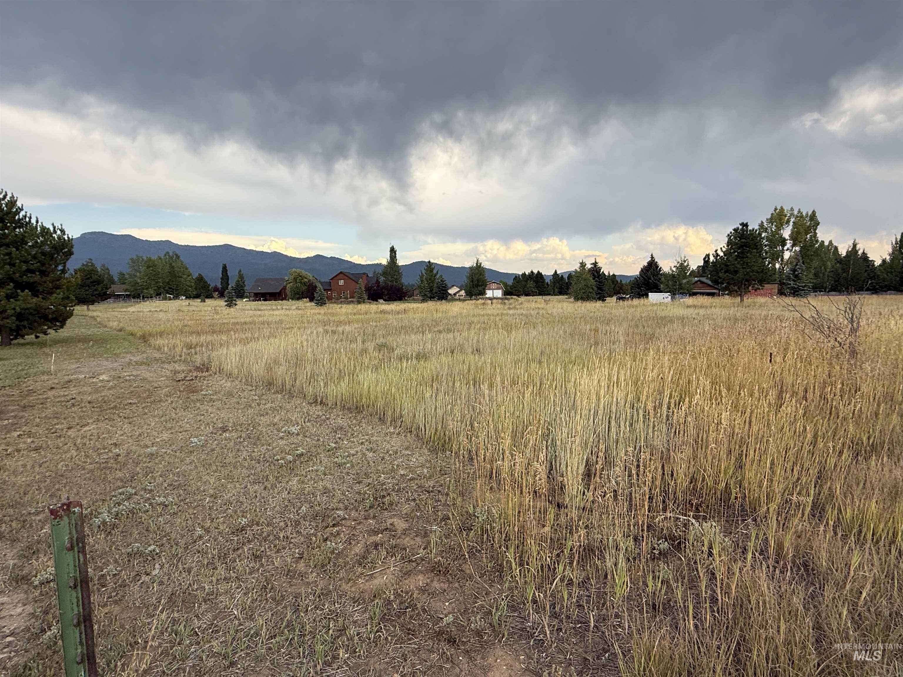 View of mountain backdrop featuring rural landscape