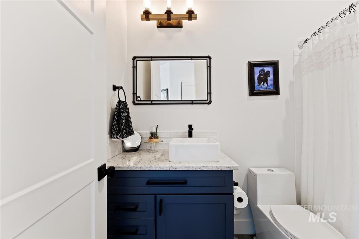 Bathroom featuring vanity and a shower with curtain