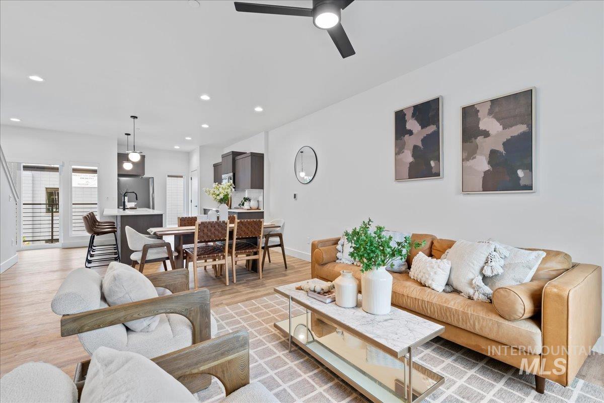 Living area featuring recessed lighting, light wood-style floors, and ceiling fan