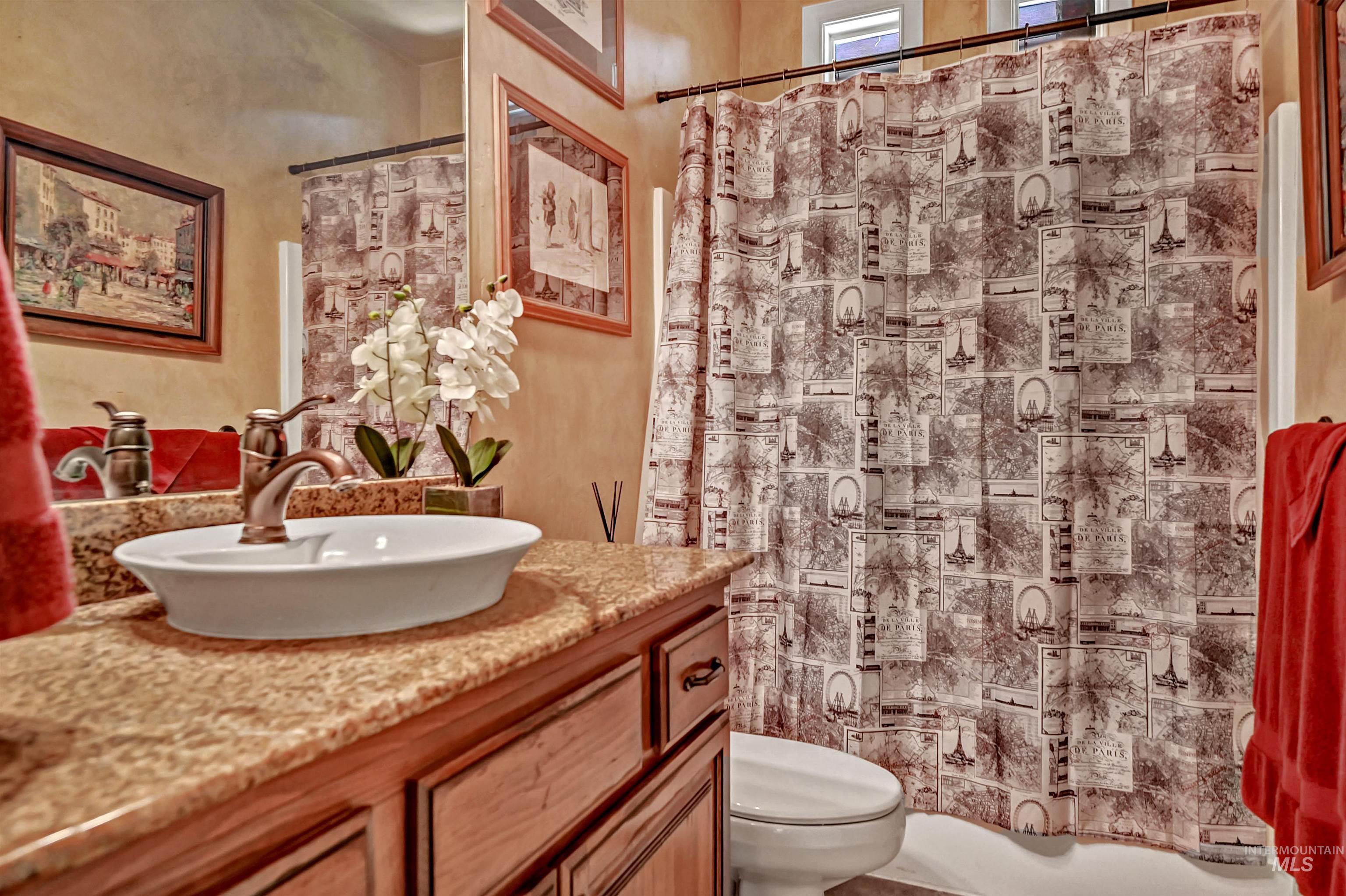 Full bath featuring vanity and toilet