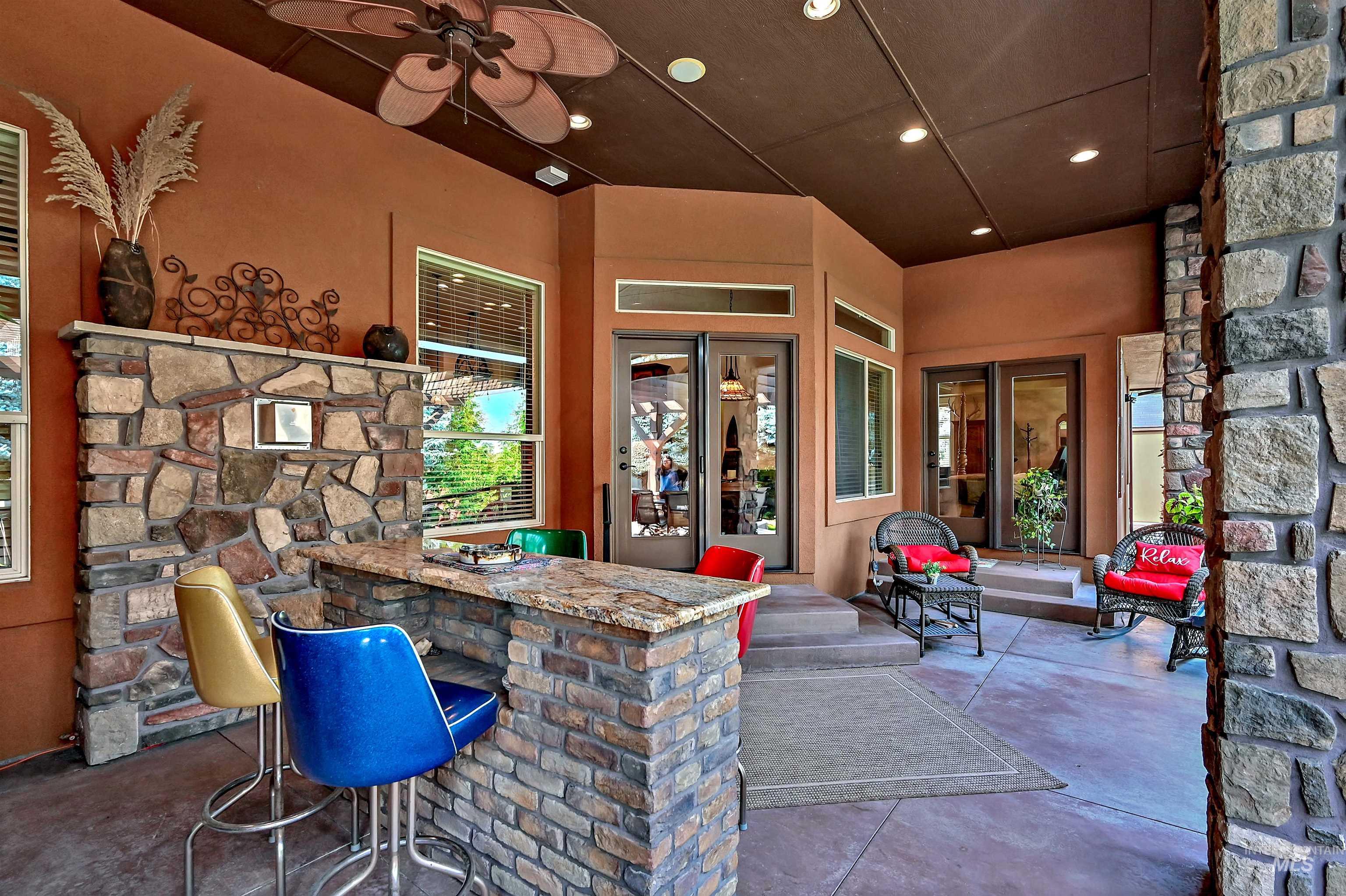 View of patio with a ceiling fan
