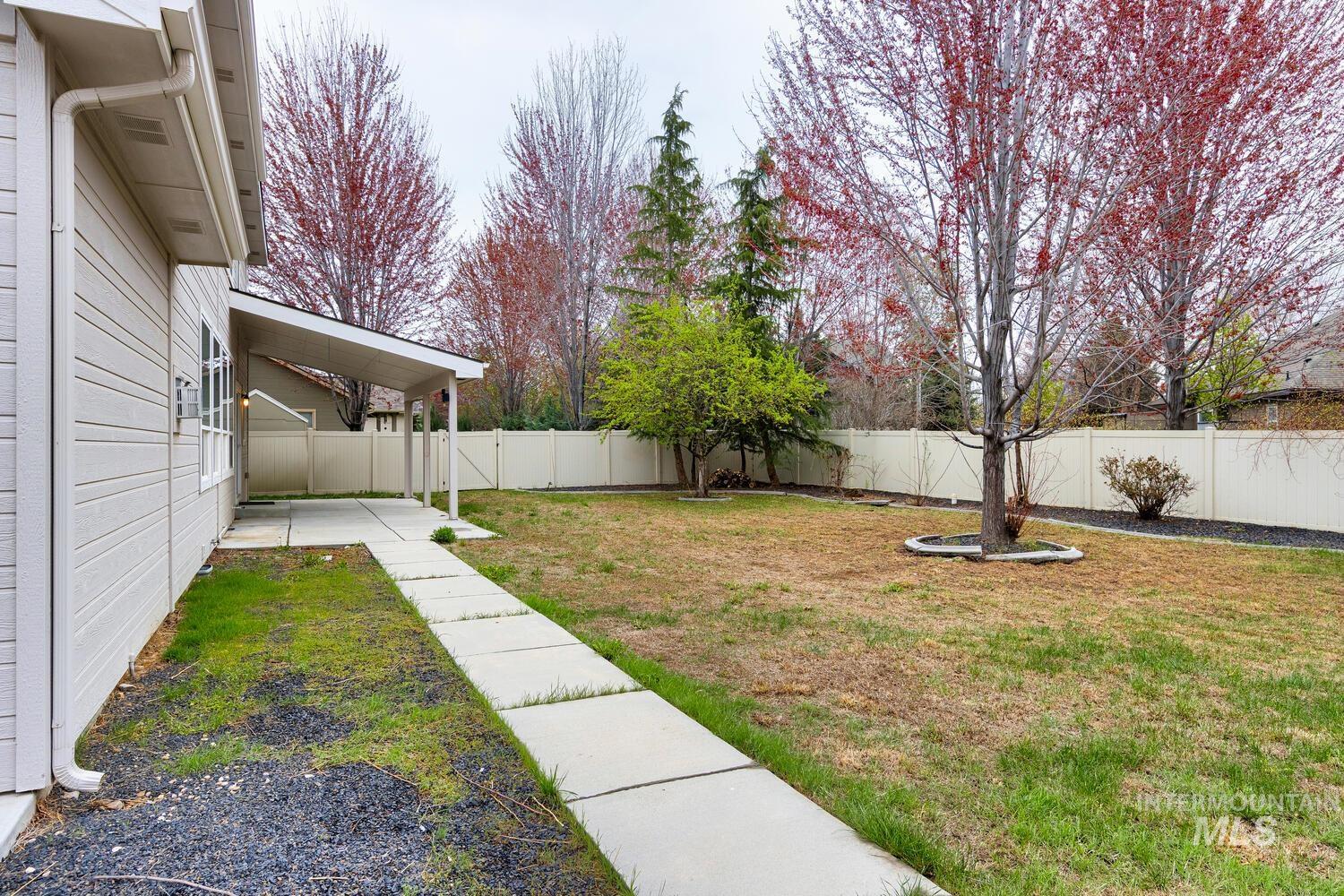 View of fenced backyard