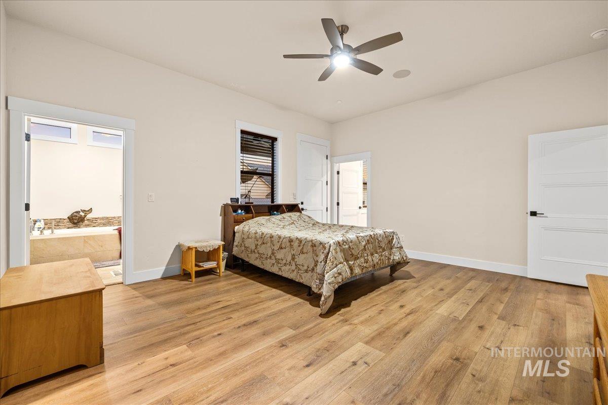 Bedroom featuring light wood finished floors and a ceiling fan