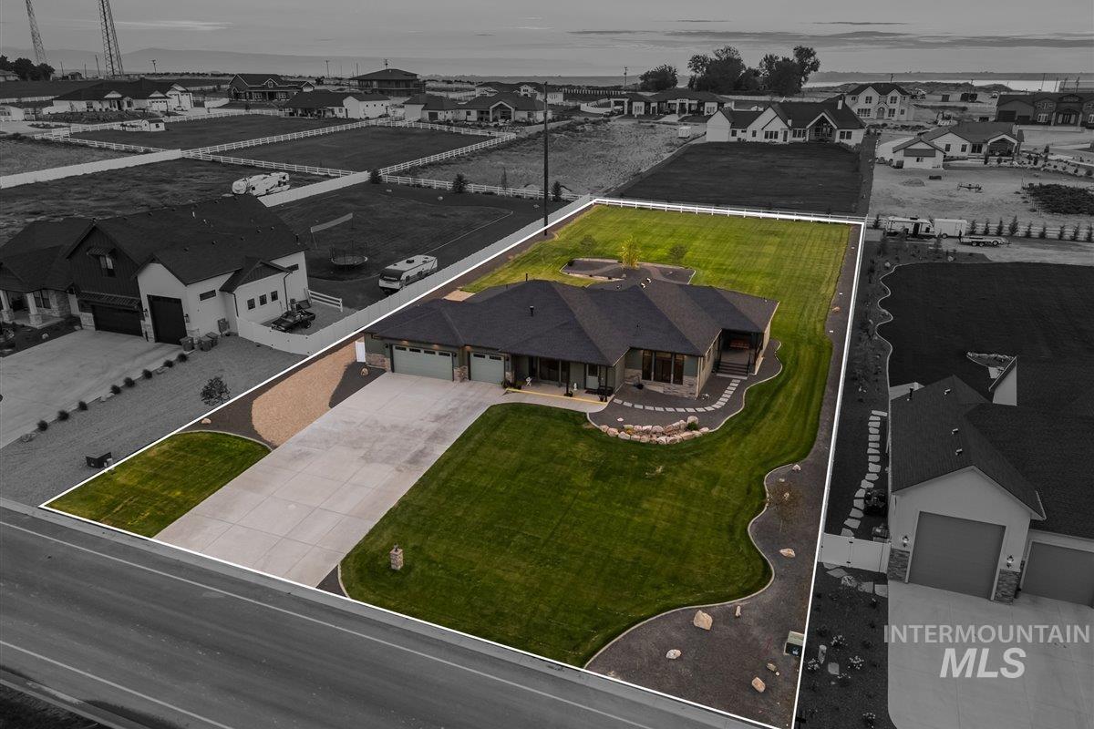 Aerial perspective of suburban area featuring property parcel outlined