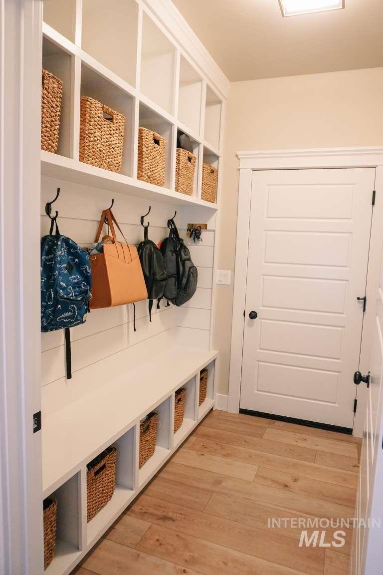 Mudroom with light wood finished floors