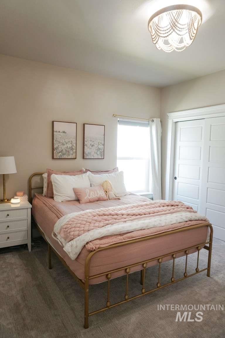 Bedroom featuring a closet and carpet floors