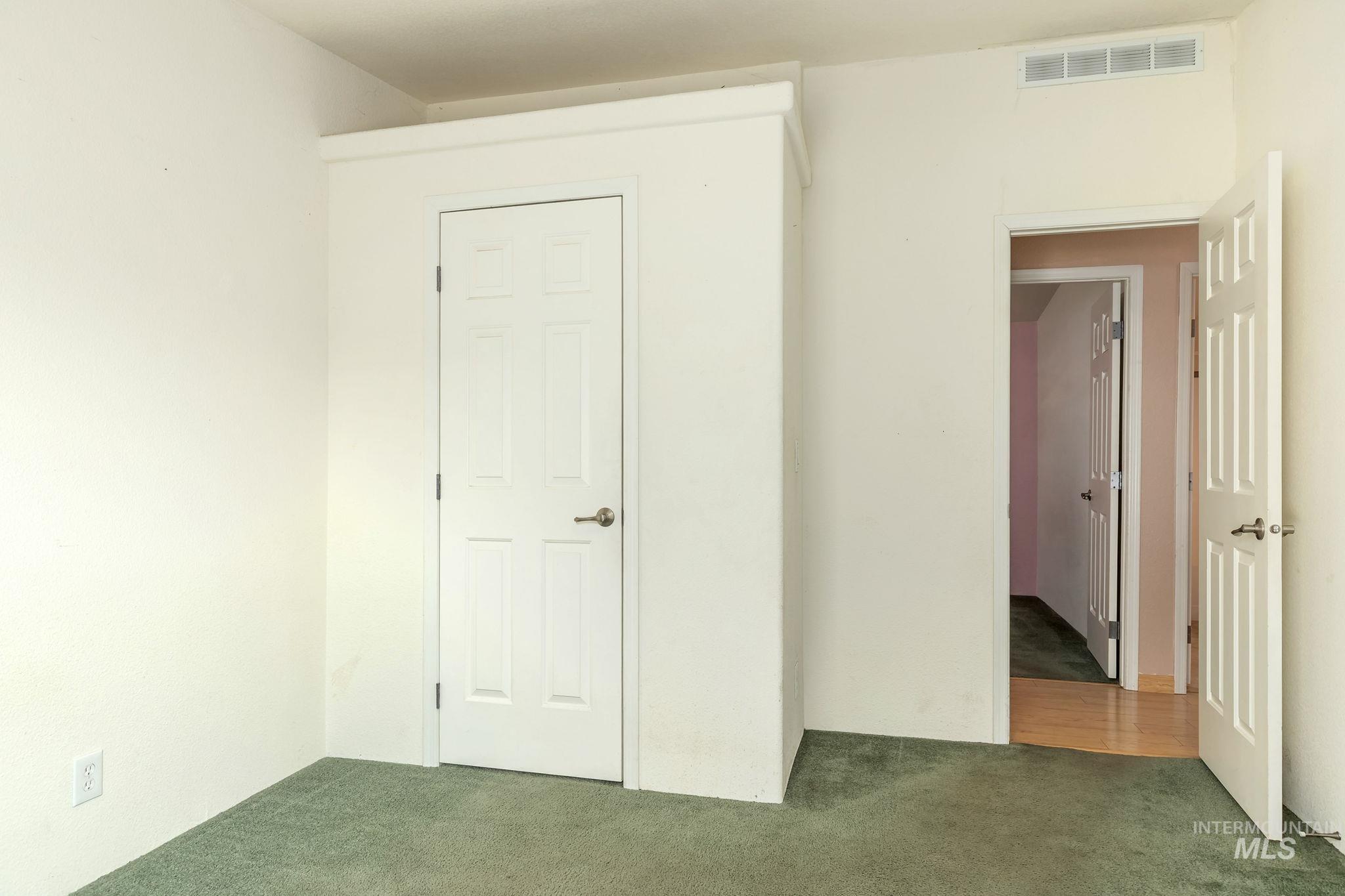 Unfurnished bedroom featuring carpet
