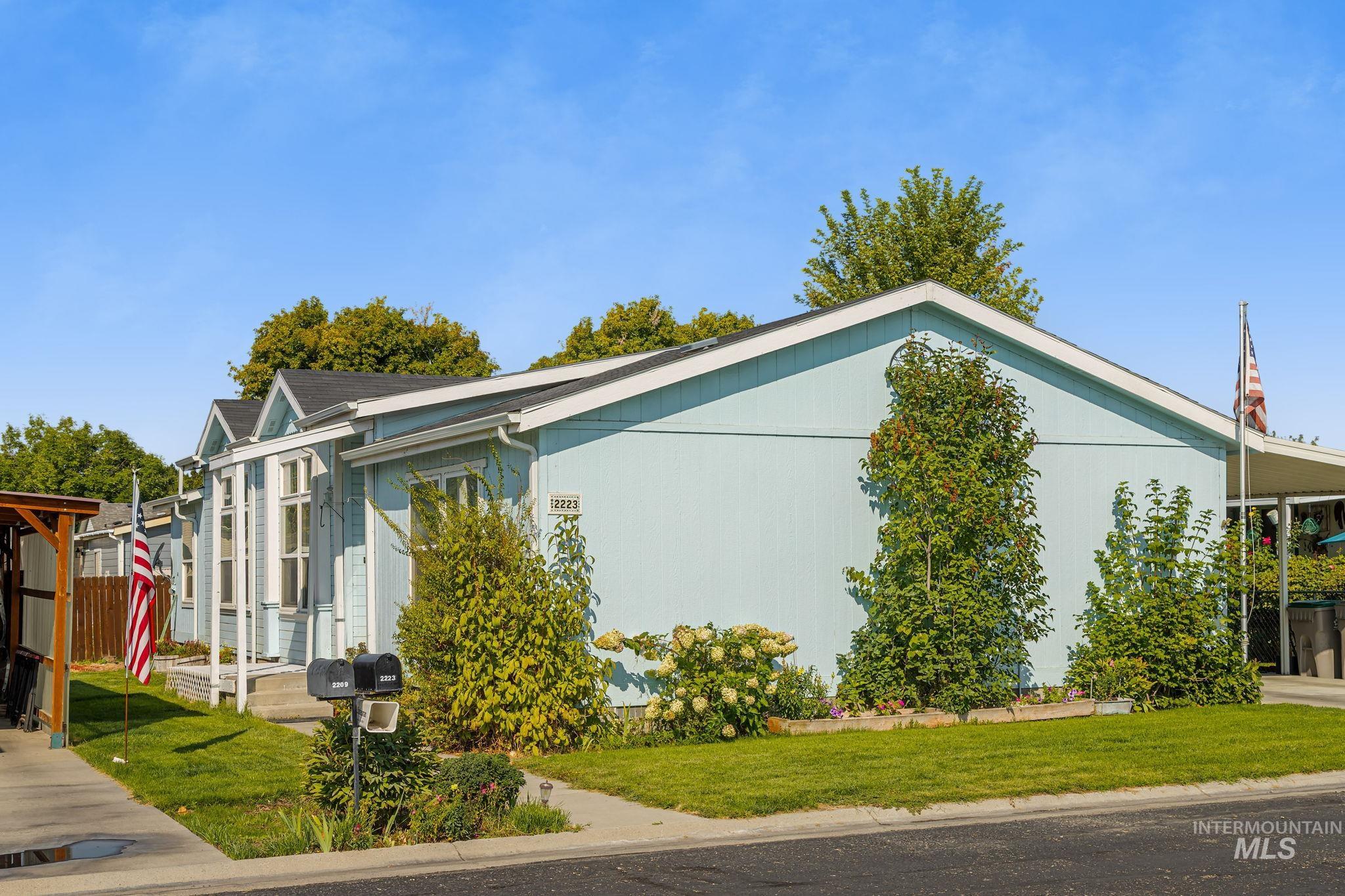 View of property exterior with a lawn