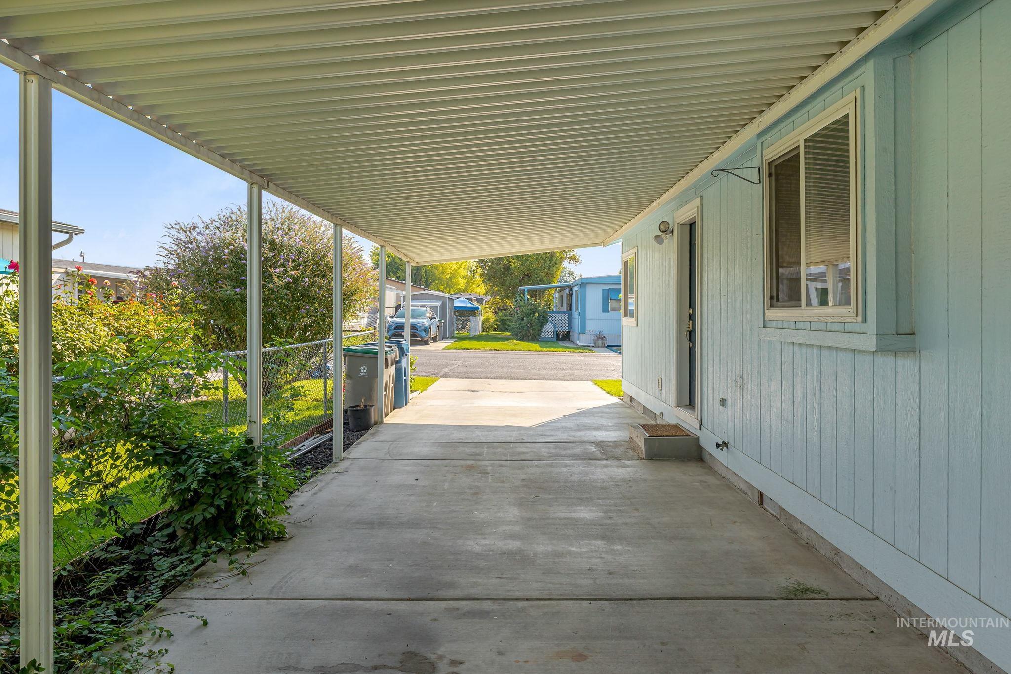 View of patio featuring an attached carport